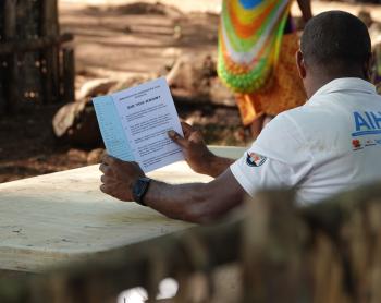 Raising awareness: a health worker educates the Yambaitok community during the health patrol.