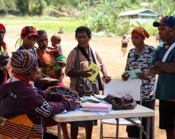 Kompiam health worker Lucy Jack attends to patients during a health patrol in Yambaitok.