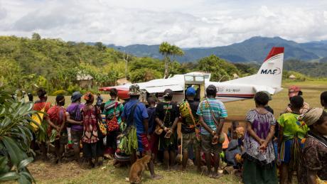 View down the Pyarulama airstrip with the crowd of people watching