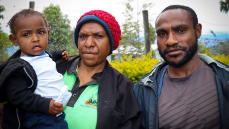 Baby Inan and her smiling parents at the Nomane Health Center.