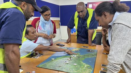 MAF staff playing the Mission Flight Board Game during a Training Session