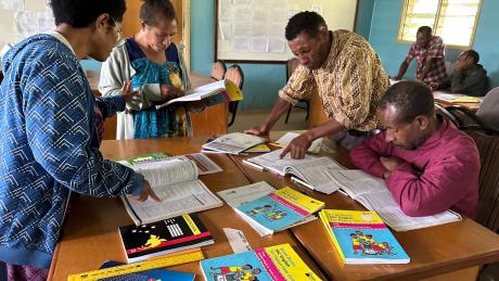 Bilum Books training course with teachers sitting around tables and working in groups