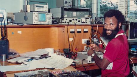 A man fixing a radio