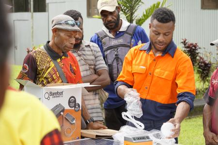 training session with village representatives on the Barefoot Solar home kit at the TCA base at Lumi