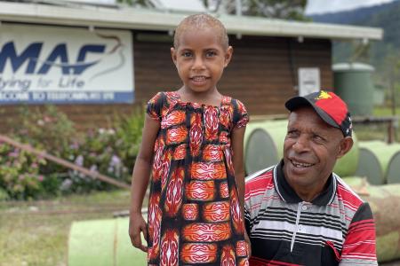 Mr Imit and his six year old daughter Grace at the Telefomin MAF base