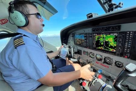 Tim Neufeld behind the controls of the Cessna Caravan