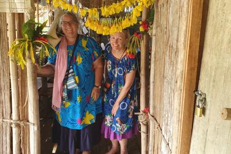 Anne Thomas (left) and Heather Robertson (right) posing at a Sepik River school they visited.
