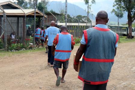 Bihute inmates loading their Bible boxes donated by MAF Technologies