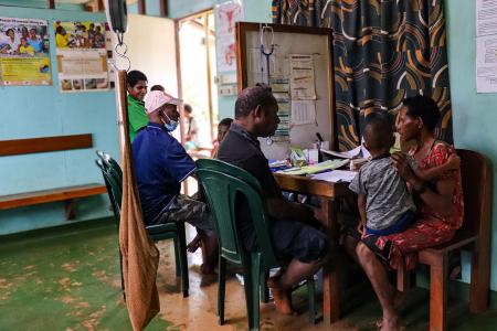 Health worker attending to a patient in the health centre