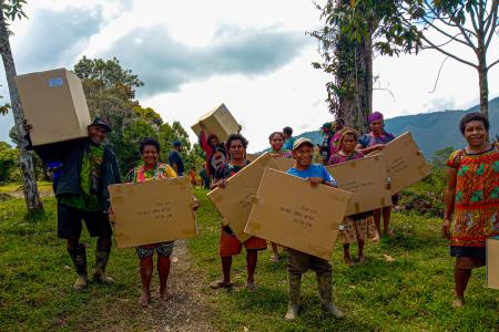 Locals from from Tolax community recieving their solar home kits