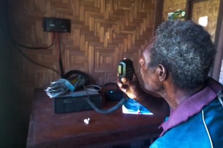 Bilson Maina, doing a test radio call to Kompiam Hospital via the High Frequency radio.