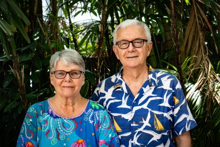 Retiree couple facing camera