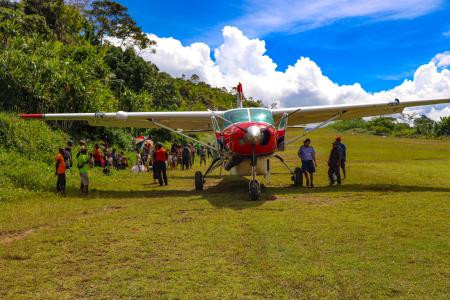 MAF aircraft lands on a remote airstrip in Eastern Highlands Province.