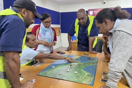 MAF staff playing the Mission Flight Board Game during a Training Session