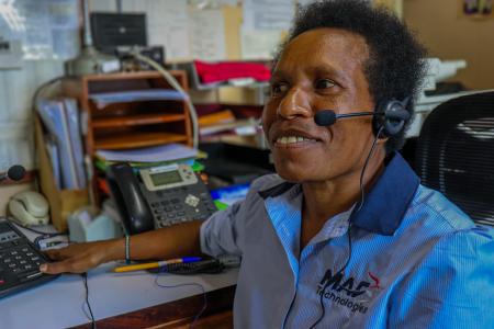 A woman using a radio headset