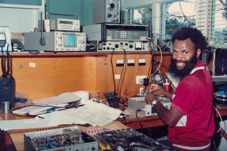 A man fixing a radio