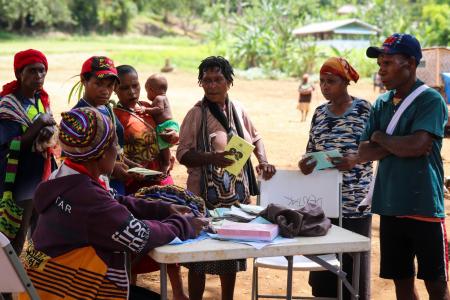 Kompiam health worker Lucy Jack attends to patients during a health patrol in Yambaitok.