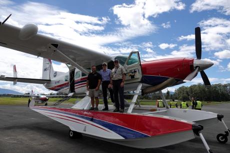 P2-WET at Mt Hagen with Terry Fahey, Chad, Tilley and Volkher Jacobsen standing on its float