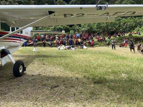 P2-AFD at Busilmin with a crowd of people gathered at the edge of the parking bay