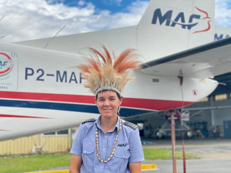 Pilot Bridhet Ingham wearing cultural head piece