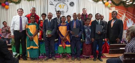 Dusin Pastor ordination - group of ordained pastors and wives with the main speakers