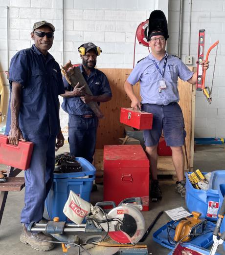 tim Newfeld and two other workmen dressed up with the new tools