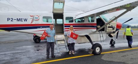 David Alison Dorricott holding flags from the Isle of Man prior to boarding  P2-MEW