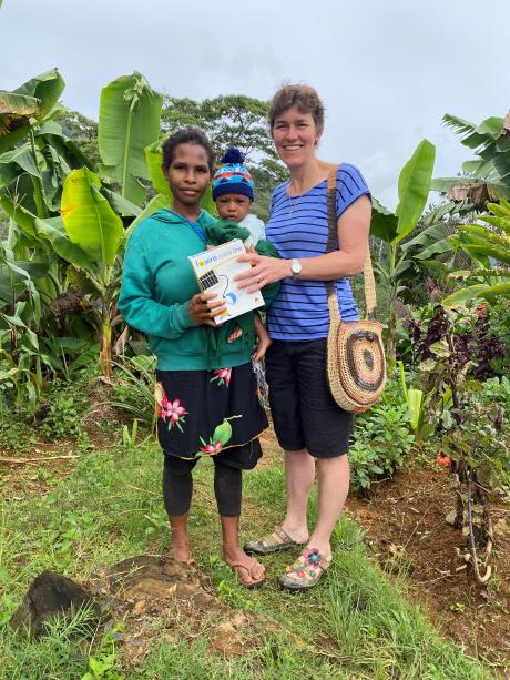 Kelin receiving the donated solar light from MAF tech