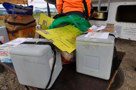 vaccine eskis and other cargo relevant for the health patrol on a trolley to be loaded into the MAF plane