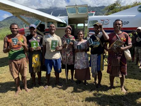 People at Dusin rejoicing over their Bibles