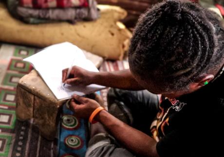Staffa Asuneng doing her homework at home