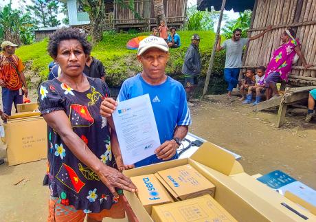 Pastor Simon and Wife from Tolax community receiving solar Kits_at_Telefomin