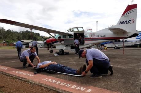 emergency exercise at pilots meeting moving people on stretchers