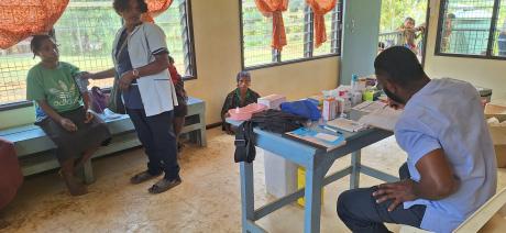 in the clinic, nurse attending to patients