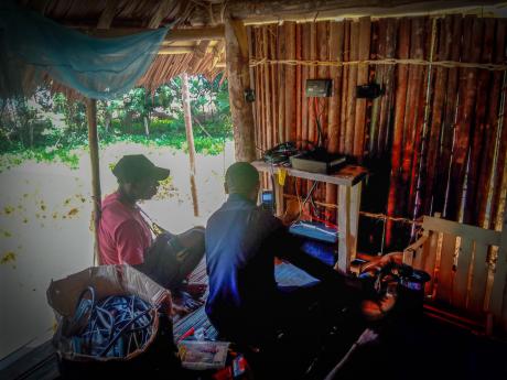MAF Technologies, technician installing a HF radio in a remote location.