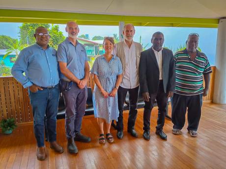 Ishmael Toroama, standing second from the right, meets with the MAF Launch Team and his advisor in Bougainville in February 2025.