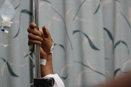 Babra's hand grabbing the IV drip stand