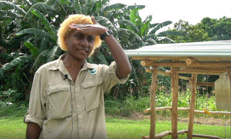 Yanu Kagayo in front of a hand washing station