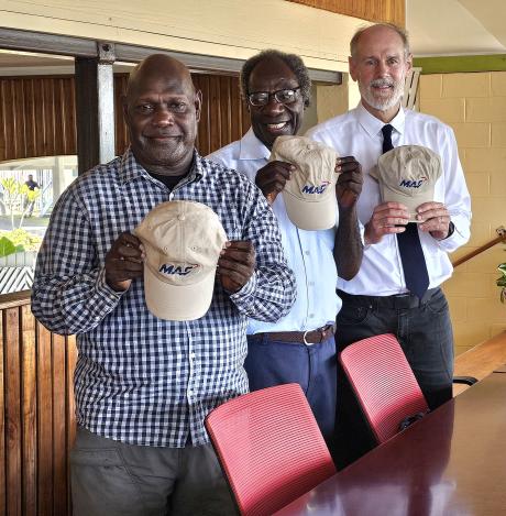 Church representatives with MAF cap