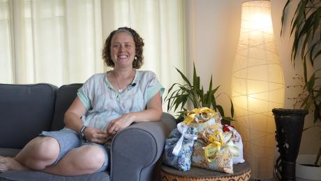 Siobhain Cole sitting in a couch smiling