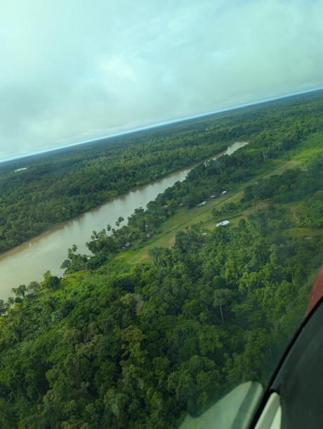 overhead Moka airstrip with the airstrip right of a river