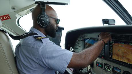Joseph Tua sitting in the cockpit