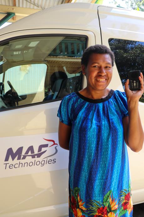 A woman holding an audio Bible 