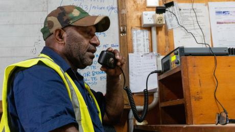 A man talks on a radio