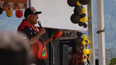 Hon. Solan Mirisim holding a speech for the celebrations