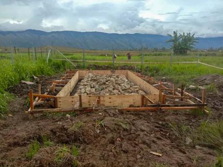 A concrete bed for the dangerous goods shed at Telefomin base.