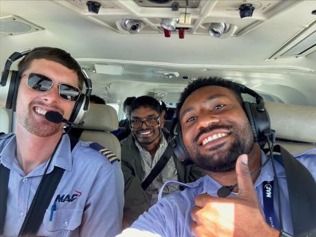 Ricky Poki alongside his flight trainer and MAF pilot, Brandon Van Saane in the cockpit.